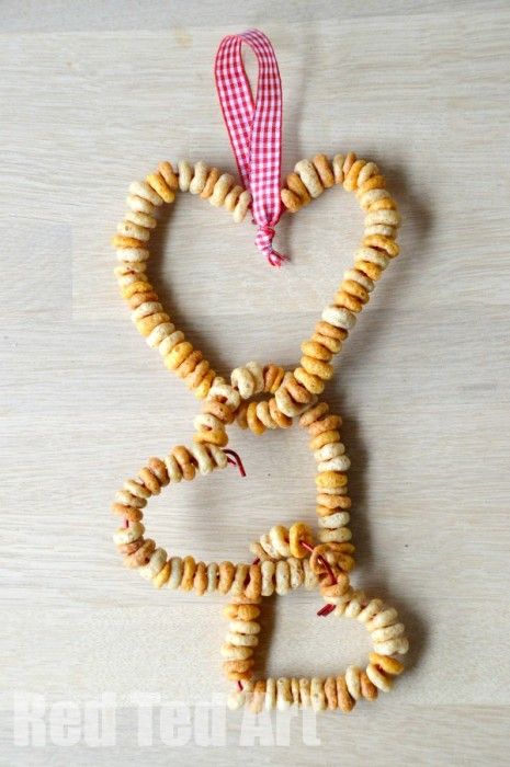 cereal strung into the shape of 3 hearts