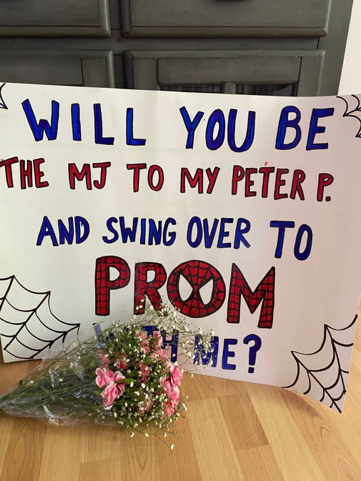 promposal poster board that reads 'will yoube the MJ to my Peter P. and swing over to prom with me?' 
