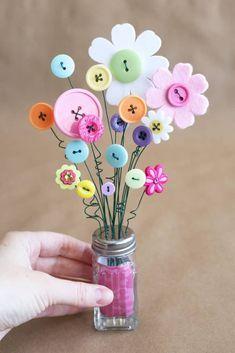 bouquets of button and foam flowers in a salt shaker