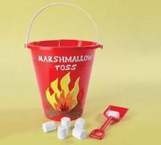 Red sand pail with campfire on the side.  Marshmallows and a sand shovel.