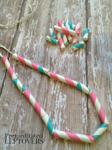 Necklace made from cut up striped straws.