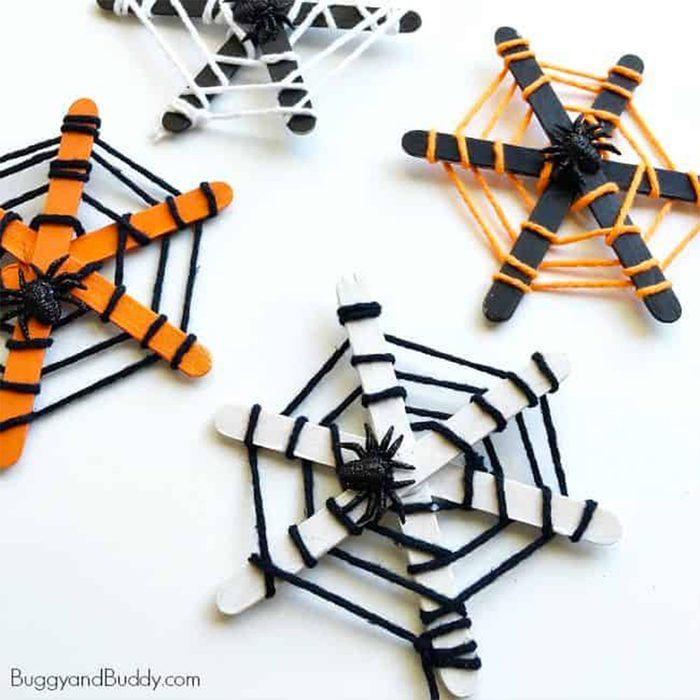 popsicle stick and yarn spider web craft